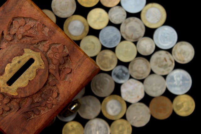 lots of coins with the box